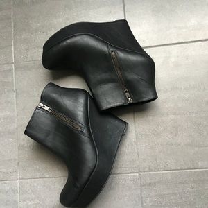 Black faux leather wedge booties